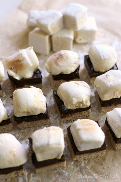 Homemade s'mores bars with homemade marshmallows on top of chocolate and cookie crust.