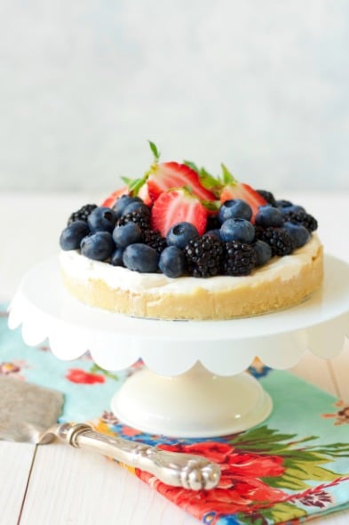 Cheesecake tart with fresh berries on top.