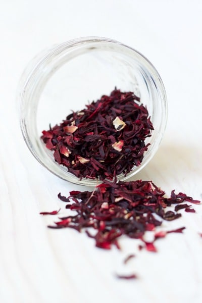Jar tipped over full of dried hibiscus blossoms.