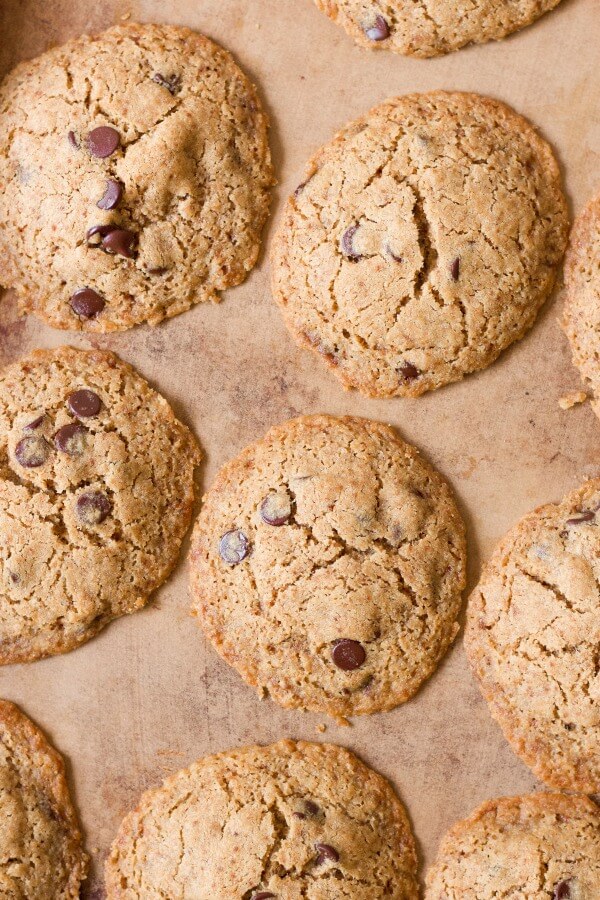 Chocolate chip cookies on a stoneware baking sheet.