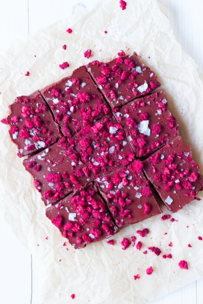 Large square of chocolate fudge cut into 9 smaller squares and topped with freeze fried raspberries.