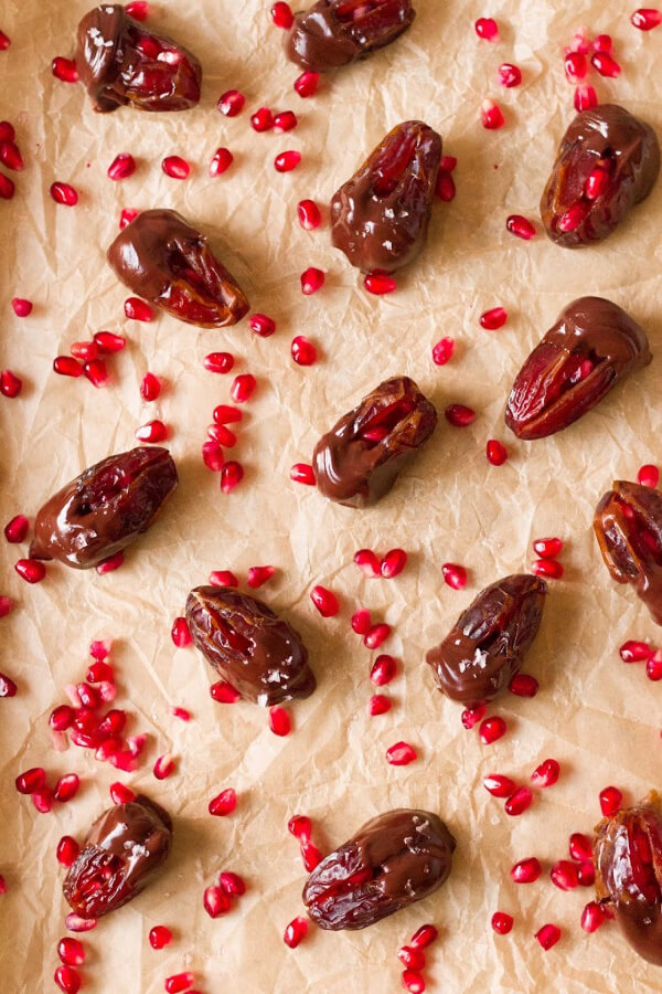 Chocolate Dipped Pomegranate Stuffed Dates from Recipes to Nourish